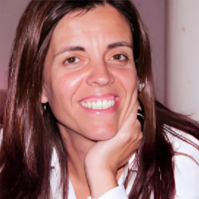 Headshot of Ana Pires, Biology Professor, smiling in front of a neutral-coloured background.